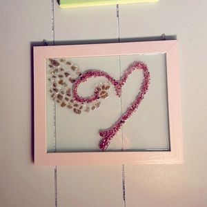 Resin paw print with heart and angel wing.